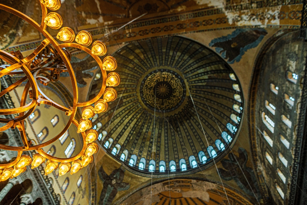 Hagia Sophia mihrab interior view with ornate Ottoman prayer niche beneath the historic central ceiling in Istanbul